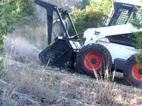 track skid steer on steep slope|bobcat steer slope.